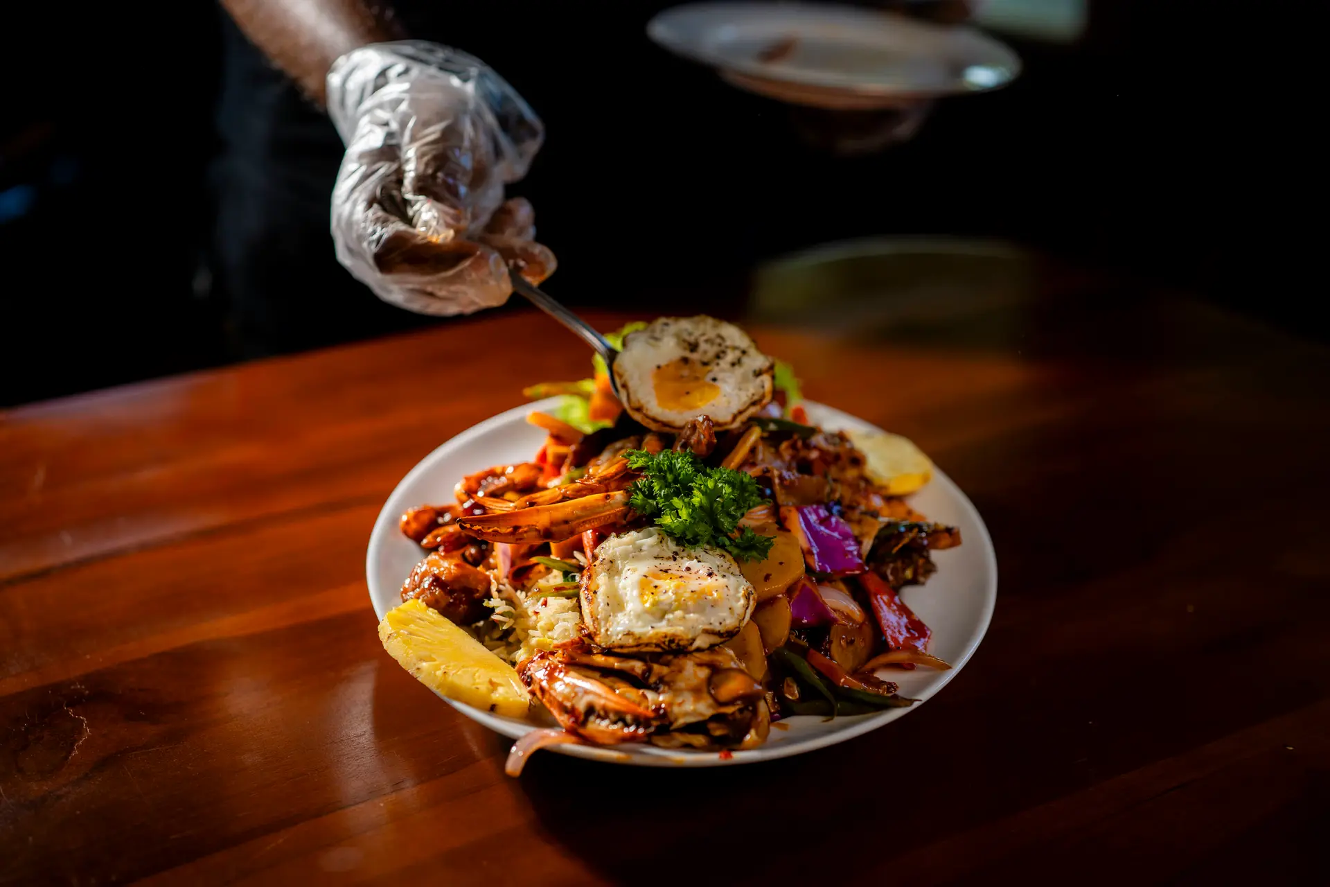 Seafood fried rice topped with crab and fried eggs