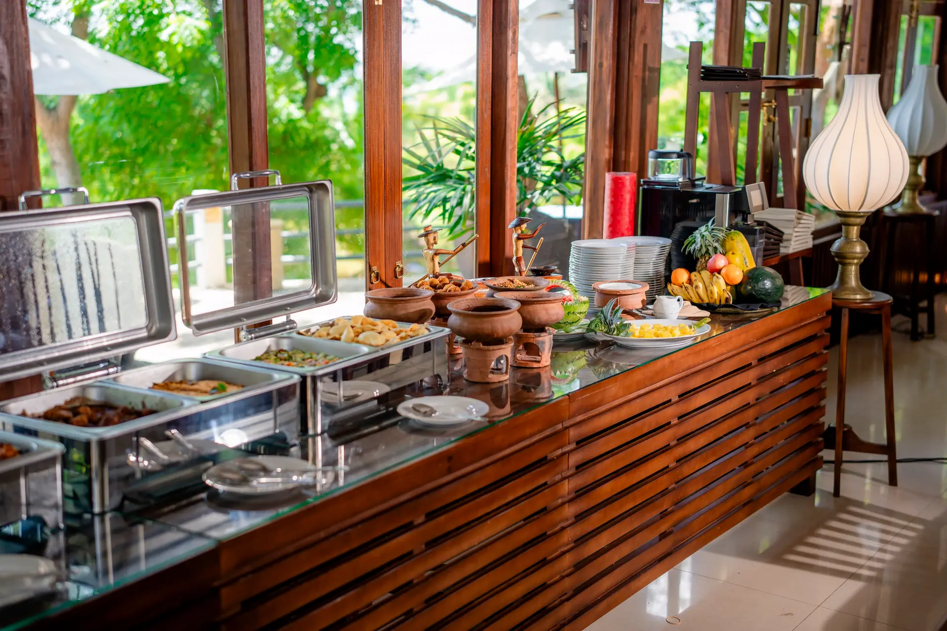 Buffet counter set with fruit and traditional pottery