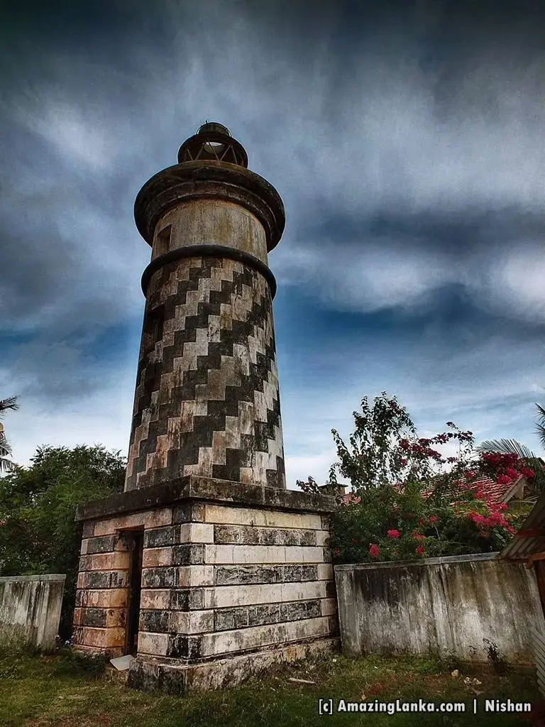 The old Hambantota lighthouse under a stormy sky