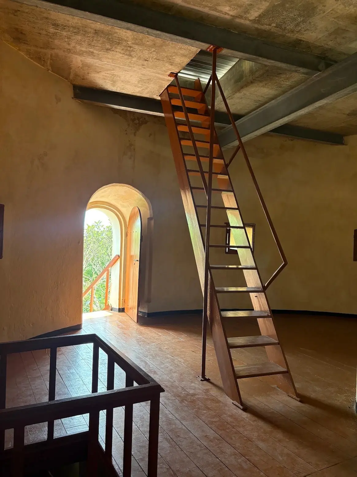 Inside the Martello Tower, a ladder rising to the upper floor