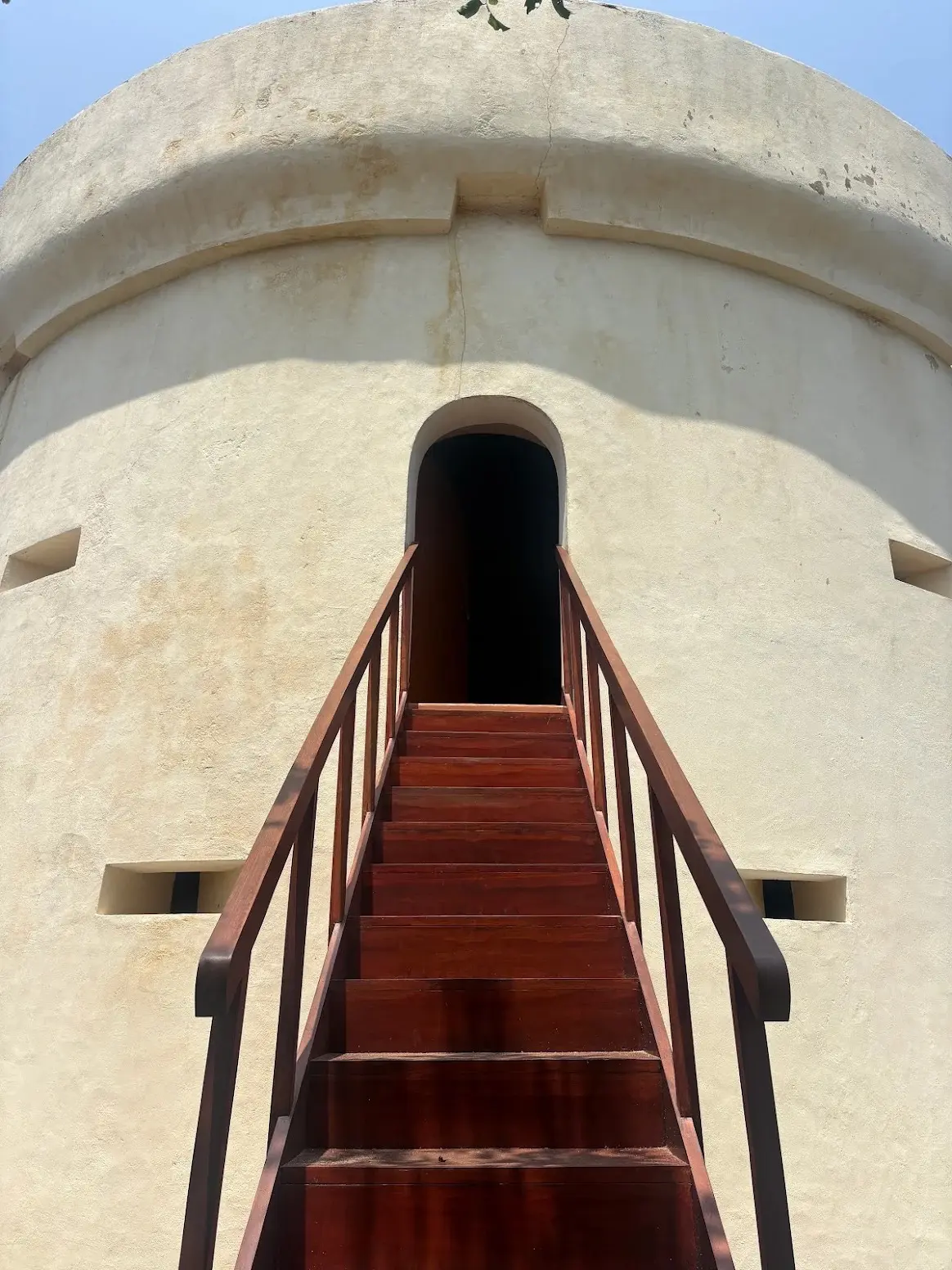 The arched entrance at the top of the tower steps