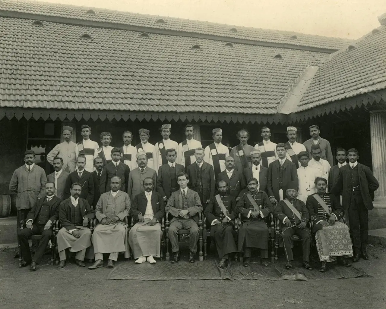 Leonard Woolf seated among the Hambantota Kachcheri staff, early 1900s
